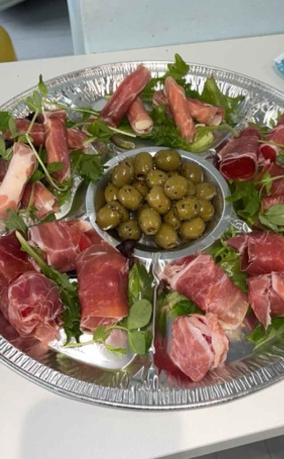 Antipasti platter with prosciutto and olives
